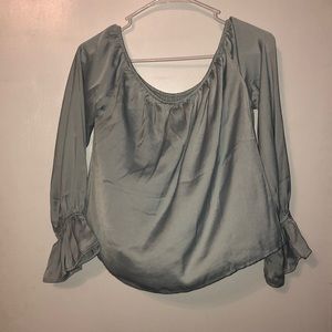 Baby blue satin off-the-shoulder top.